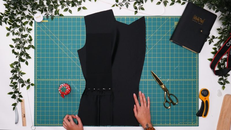 How To Pin Sew Pocket Bag Top - - Mood Fabrics - Nolita Vest and Skirt Set Free Sewing Pattern Tutorial - MDF466 MDF467 - Mood Fabrics Sewciety Blog - Pin and sew one side of the pocket bag right sides together with the top welt.