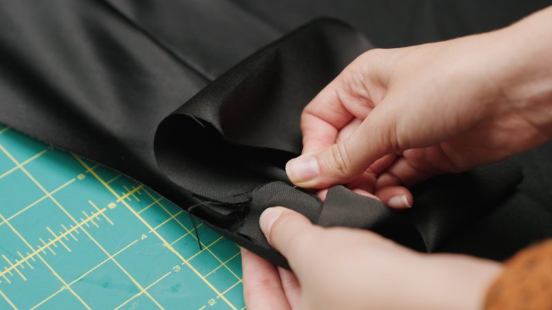 How To Pin Sew Pocket Bag Bottom - - Mood Fabrics - Nolita Vest and Skirt Set Free Sewing Pattern Tutorial - MDF466 MDF467 - Mood Fabrics Sewciety Blog - Pin and sew the other side of the pocket bag right sides together with the bottom welt.