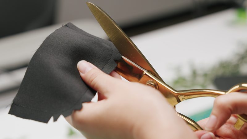 How To Cut Pocket Flap Notches - - Mood Fabrics - Nolita Vest and Skirt Set Free Sewing Pattern Tutorial - MDF466 MDF467 - Mood Fabrics Sewciety Blog - Cut notches in the curved edges of the pocket flap.