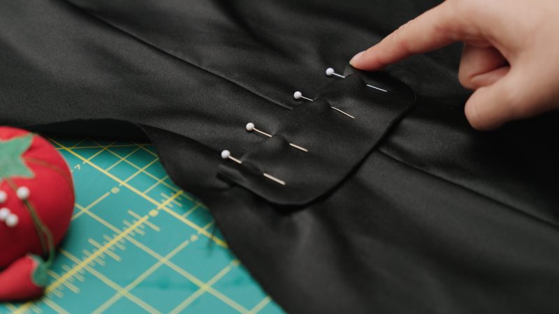 How To Pin Sew Pocket Flap Above Welt - - Mood Fabrics - Nolita Vest and Skirt Set Free Sewing Pattern Tutorial - MDF466 MDF467 - Mood Fabrics Sewciety Blog - Pin and sew the pocket flap above the welt pocket.
