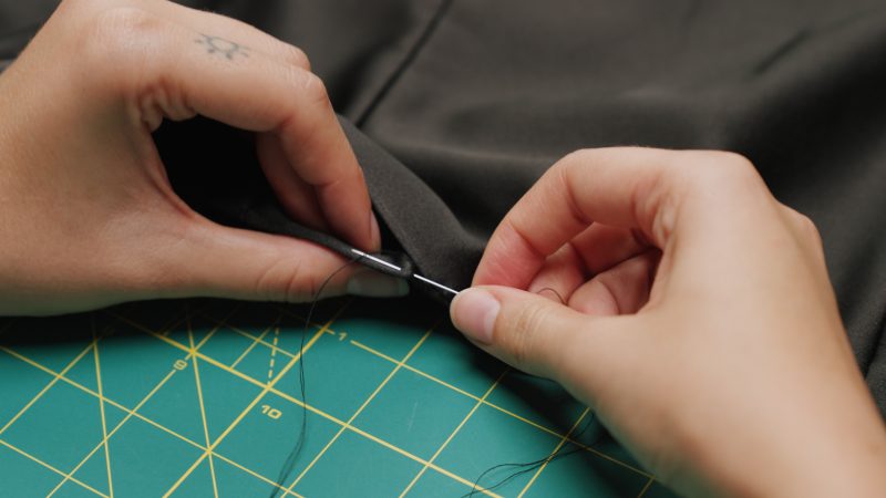 How To Sew Hem Opening By Hand - - Mood Fabrics - Nolita Vest and Skirt Set Free Sewing Pattern Tutorial - MDF466 MDF467 - Mood Fabrics Sewciety Blog - Hand sew a ladder stitch to close the gap in the hem.
