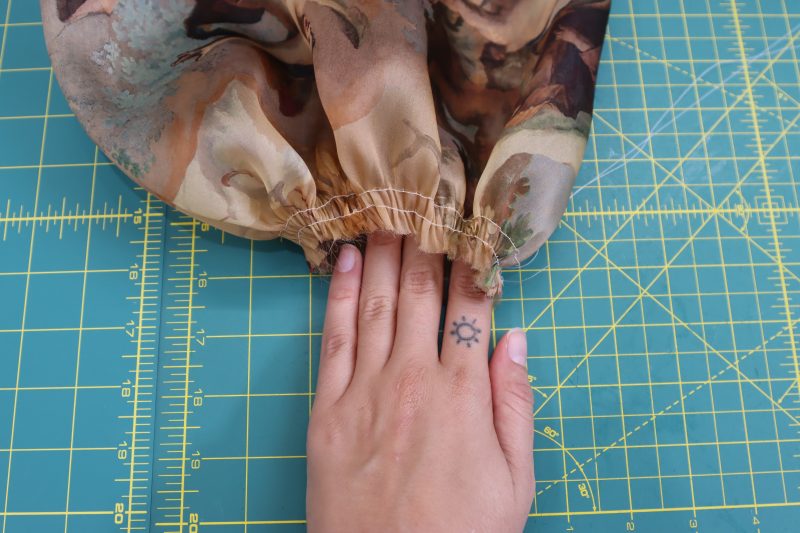 How To Gather Sleeve Opening - Silk Organza - Mood Fabrics - Firenze Blouse Trousers Free Sewing Pattern Tutorial - MDF464 - Mood Fabrics Sewciety Blog - Gather the edge of the sleeve opening.