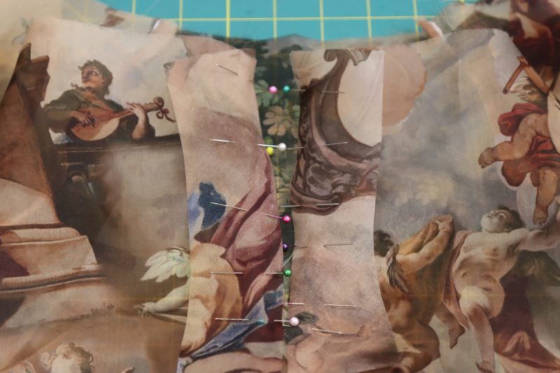 How To Pin Sew Neck Slit Facings - Silk Organza - Mood Fabrics - Firenze Blouse Trousers Free Sewing Pattern Tutorial - MDF464 - Mood Fabrics Sewciety Blog - Pin and sew the facing pieces right sides together with the either side of the neckline opening.