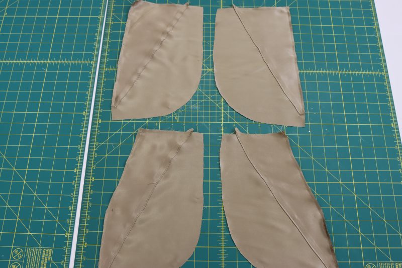 How To Sew Pocket Facings To Pocket Bags - Satin - Mood Fabrics - Firenze Blouse Trousers Free Sewing Pattern Tutorial - MDF464 - Mood Fabrics Sewciety Blog - Sew the pocket facings to the pocket bags.
