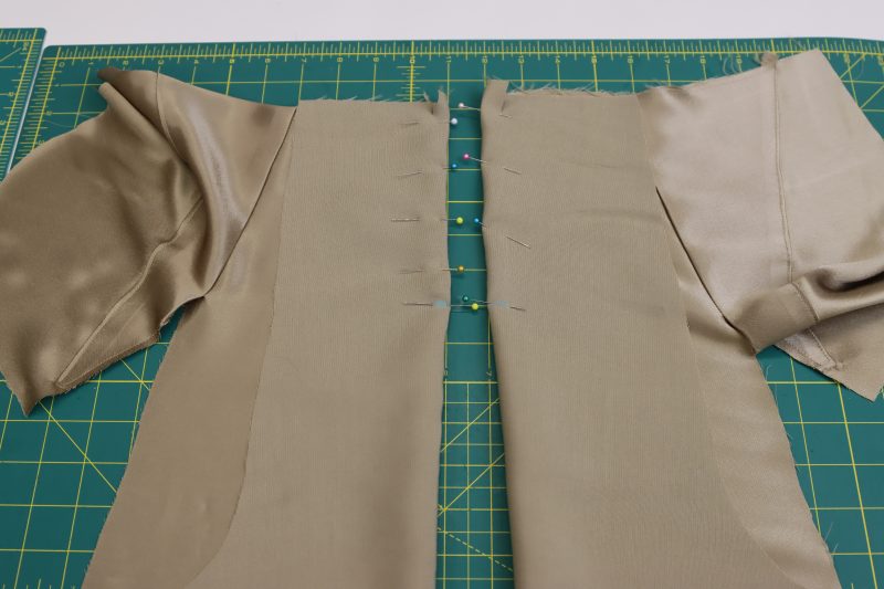 How To Pin Sew Darts - Satin - Mood Fabrics - Firenze Blouse Trousers Free Sewing Pattern Tutorial - MDF464 - Mood Fabrics Sewciety Blog - Pin and sew a diagonal line matching the notches and dart tip.