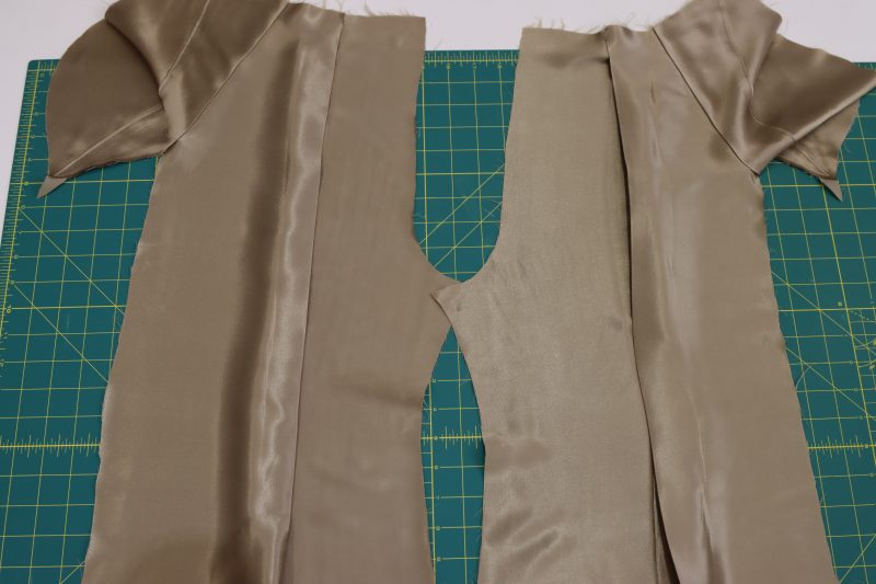 How To Iron Pleats - Satin - Mood Fabrics - Firenze Blouse Trousers Free Sewing Pattern Tutorial - MDF464 - Mood Fabrics Sewciety Blog - Iron the front pleats towards the side seams of the pants.