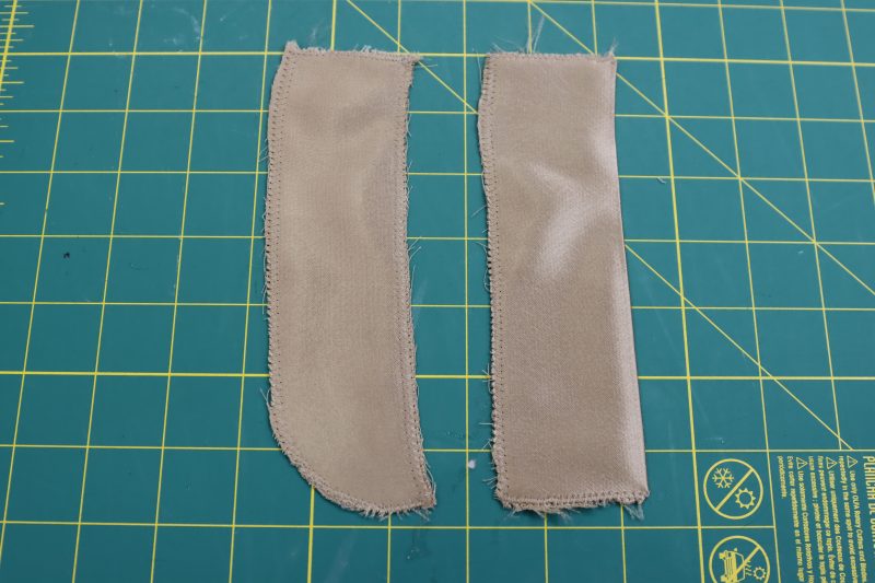 How To Serge Fly Pieces - Satin - Mood Fabrics - Firenze Blouse Trousers Free Sewing Pattern Tutorial - MDF464 - Mood Fabrics Sewciety Blog - Zigzag or serge the edges of the fly shield and fly facing.