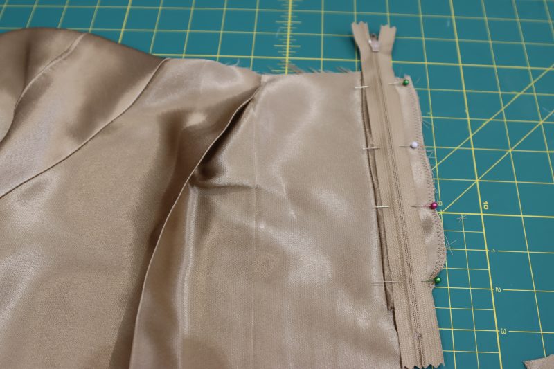 How To Pin Sew Zipper To Fly Facing - Regular Zipper - Mood Fabrics - Firenze Blouse Trousers Free Sewing Pattern Tutorial - MDF464 - Mood Fabrics Sewciety Blog - Pin and sew the zipper to the fly facing, right sides together.