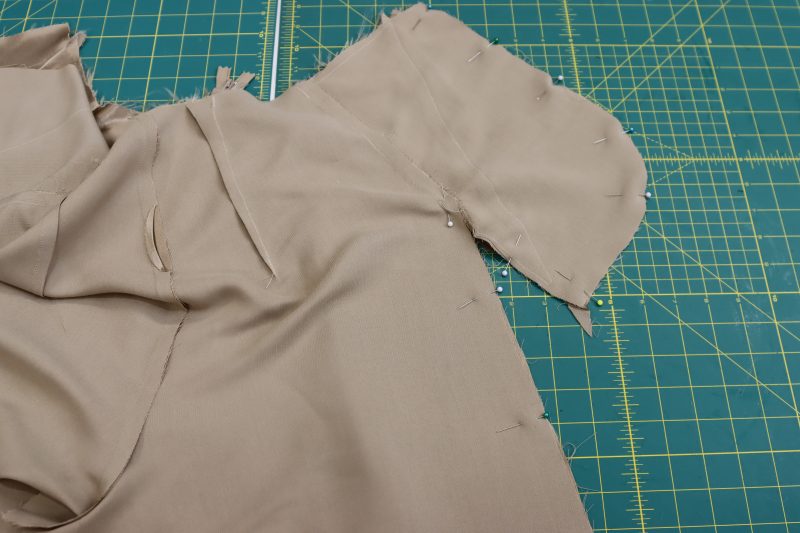 How To Pin Sew Side Seams - Satin - Mood Fabrics - Firenze Blouse Trousers Free Sewing Pattern Tutorial - MDF464 - Mood Fabrics Sewciety Blog - Pin and sew both side seams of the pants from the top of the pocket to the bottom hem of the pants.