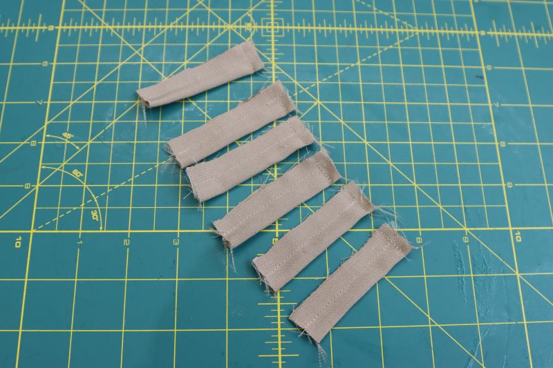 How To Sew Belt Loops Into Tubes - Satin - Mood Fabrics - Firenze Blouse Trousers Free Sewing Pattern Tutorial - MDF464 - Mood Fabrics Sewciety Blog - Sew each belt loop right sides together into a tube that is open on one end.