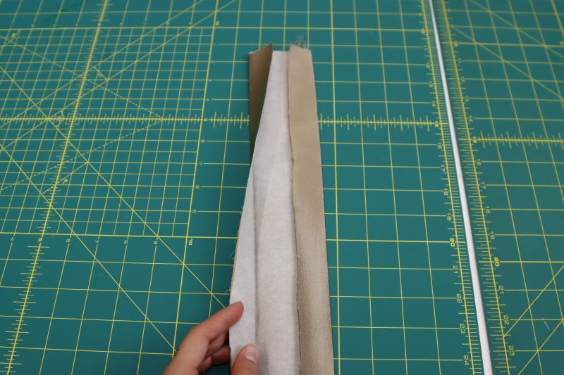 How To Fold Waistband - Satin - Mood Fabrics - Firenze Blouse Trousers Free Sewing Pattern Tutorial - MDF464 - Mood Fabrics Sewciety Blog - Fold in the edges of the interfaced waistband.