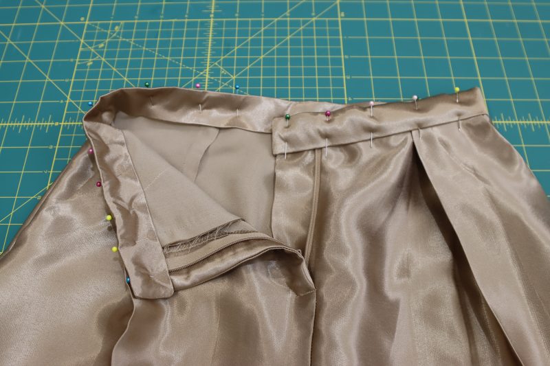 How To Pin Sew Waistband - Satin - Mood Fabrics - Firenze Blouse Trousers Free Sewing Pattern Tutorial - MDF464 - Mood Fabrics Sewciety Blog - Pin and sew the waistband onto the waist opening.