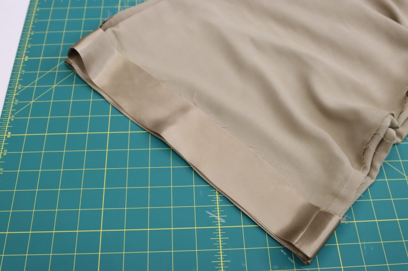How To Iron Pants Hem - Satin - Mood Fabrics - Firenze Blouse Trousers Free Sewing Pattern Tutorial - MDF464 - Mood Fabrics Sewciety Blog - Iron a wide hem into the bottom of the pants.