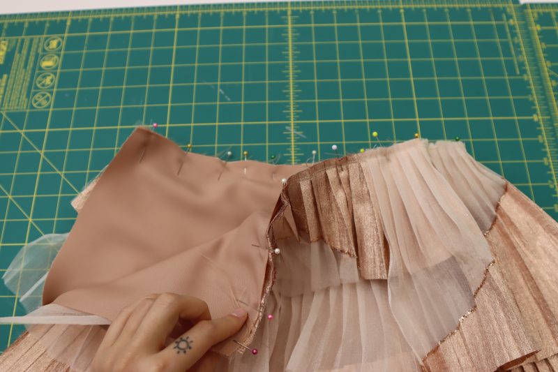 How To Pin Sew Skirt Wasitlines - Satin - Mood Fabrics - Nolita Vest and Skirt Set Free Sewing Pattern Tutorial - MDF466 MDF467 - Mood Fabrics Sewciety Blog - Pin and sew the waistlines of the tulle and satin skirt together.