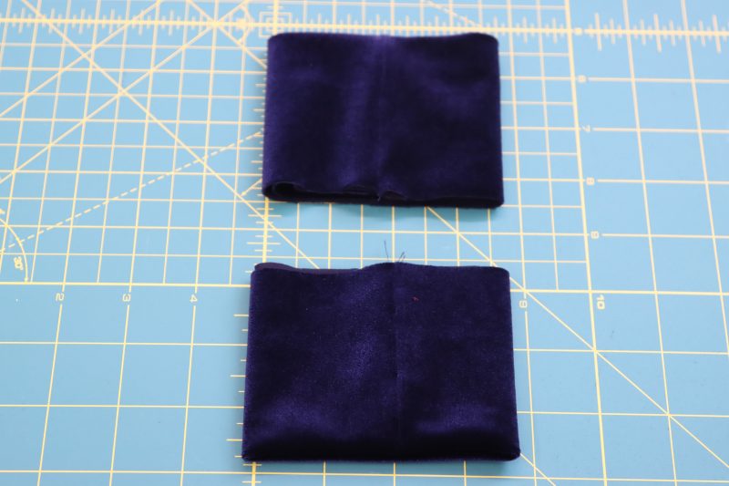 How To Fold Cuffs - Stretch Velour - Mood Fabrics - Tarrytown Tracksuit Free Sewing Pattern Tutorial - MDF471 - Mood Fabrics Sewciety Blog - Fold cuffs wrong sides together so that the seam allowance is hidden.
