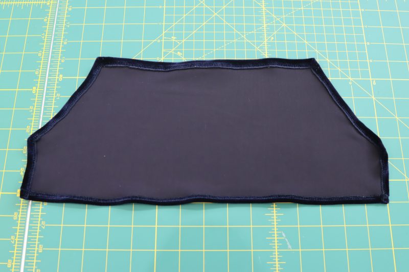 How To Sew Serged Edges - Stretch Velour - Mood Fabrics - Tarrytown Tracksuit Free Sewing Pattern Tutorial - MDF471 - Mood Fabrics Sewciety Blog - Sew the serged edges of the pocket pouch towards the wrong side of the fabric.