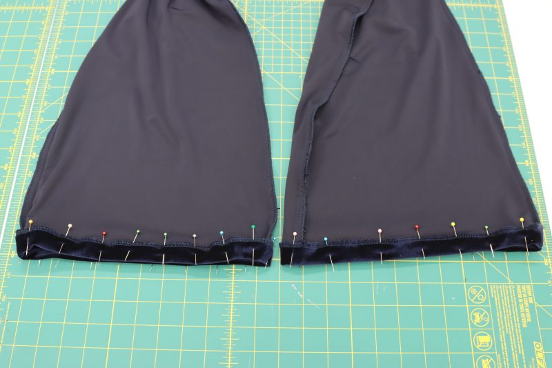 How To Pin Sew Pants Hem - Stretch Velour - Mood Fabrics - Tarrytown Tracksuit Free Sewing Pattern Tutorial - MDF471 - Mood Fabrics Sewciety Blog - Pin and sew the folded hem at the bottom of the pant legs.