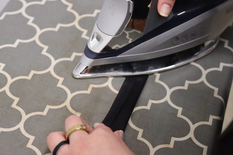 How To Iron Bias Strip - Mercerized Organic Egyptian Cotton Voile - Mood Fabrics - Coeur D'Alene Coat Free Sewing Pattern Tutorial - MDF472 - Mood Fabrics Sewciety Blog - Iron the folds in place.