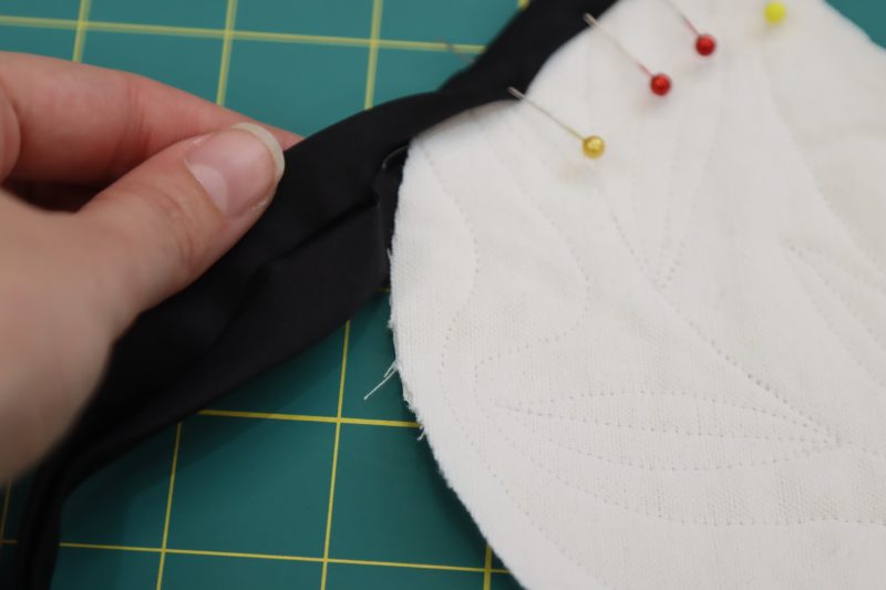How To Sandwich Pocket Raw Edges - Mercerized Organic Egyptian Cotton Voile - Mood Fabrics - Coeur D'Alene Coat Free Sewing Pattern Tutorial - MDF472 - Mood Fabrics Sewciety Blog - Encase the raw edges of the pockets with the bias binding.
