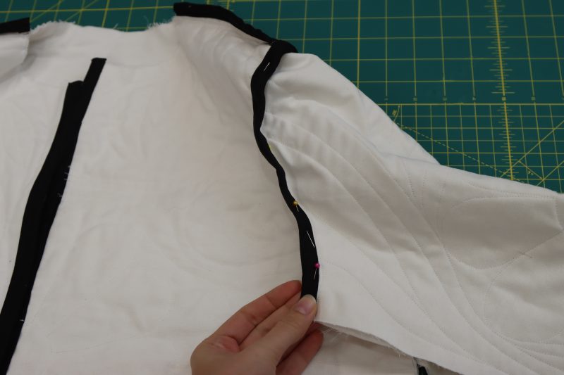 How To Attach Bias Binding - Mercerized Organic Egyptian Cotton Voile - Mood Fabrics - Coeur D'Alene Coat Free Sewing Pattern Tutorial - MDF472 - Mood Fabrics Sewciety Blog - Attach bias binding to the seam allowance of the armcyes.
