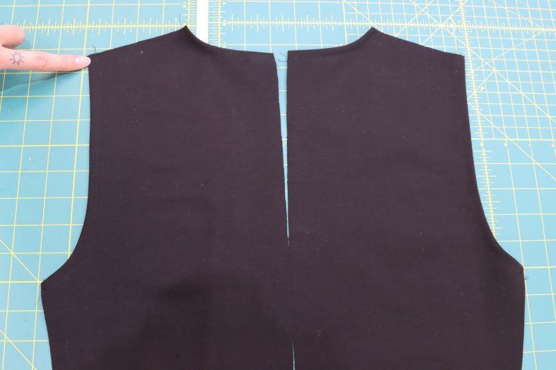 How To Sew Neckline And Armholes - Stretch Ponte Knit - Mood Fabrics - Ketchum Jumpsuit Free Sewing Pattern Tutorial - MDF473 - Mood Fabrics Sewciety Blog - Sew a hem along the edge of the collar and the armholes.