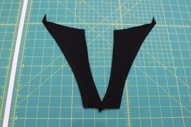 How To Pin Sew Strap Edges - Stretch Ponte Knit - Mood Fabrics - Ketchum Jumpsuit Free Sewing Pattern Tutorial - MDF473 - Mood Fabrics Sewciety Blog - Pin and sew a fold into the long edges of the straps.