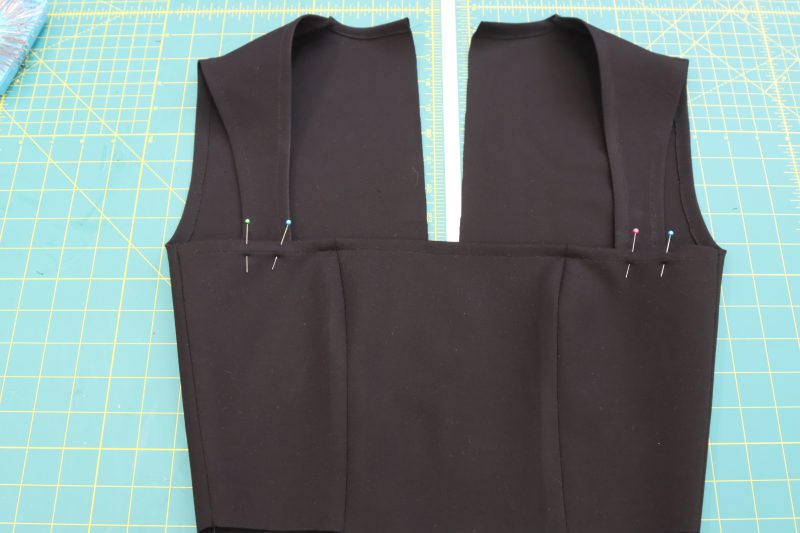 How To Pin Front Straps - Stretch Ponte Knit - Mood Fabrics - Ketchum Jumpsuit Free Sewing Pattern Tutorial - MDF473 - Mood Fabrics Sewciety Blog - Pin the other sides of the straps to the wrong side of the top front.