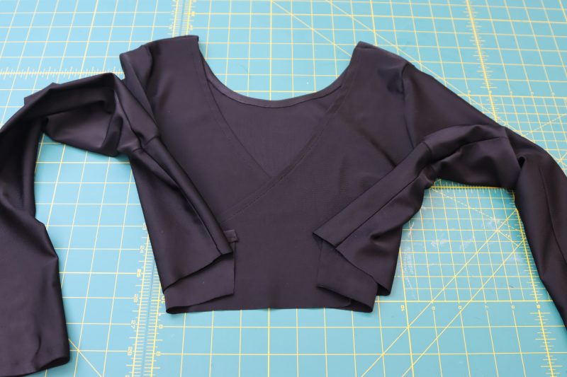 How To Sew Side Seams - Performance Spandex - Mood Fabrics - Adagio Wrap Cardigan Free Sewing Pattern Tutorial - MDF478 - Mood Fabrics Sewciety Blog - Sew the sleeve and side seams of the top together.