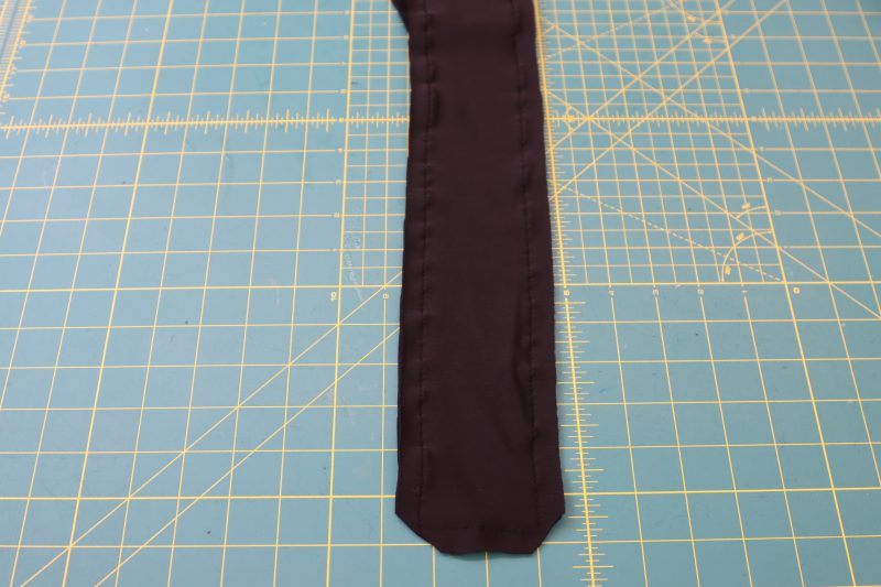 How To Sew Wrap Ties - Performance Spandex - Mood Fabrics - Adagio Wrap Cardigan Free Sewing Pattern Tutorial - MDF478 - Mood Fabrics Sewciety Blog - Sew around 3 sides of the ties and clip the pointy corners.