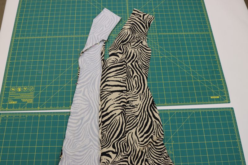 How To Serge Front Side Pieces - Interlock Knit - Mood Fabrics - Soho Maxi Slip Dress Free Sewing Pattern Tutorial - MDF474 - Mood Fabrics Sewciety Blog - Serge the front sides to the front center.