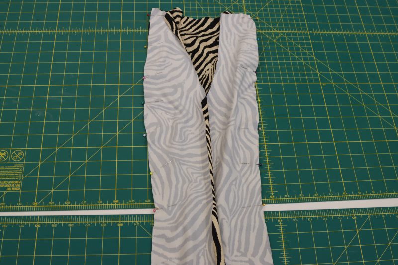 How To Pin Back Side Pieces - Interlock Knit - Mood Fabrics - Soho Maxi Slip Dress Free Sewing Pattern Tutorial - MDF474 - Mood Fabrics Sewciety Blog - Pin the back side pieces right sides together with the sides of the back center piece.
