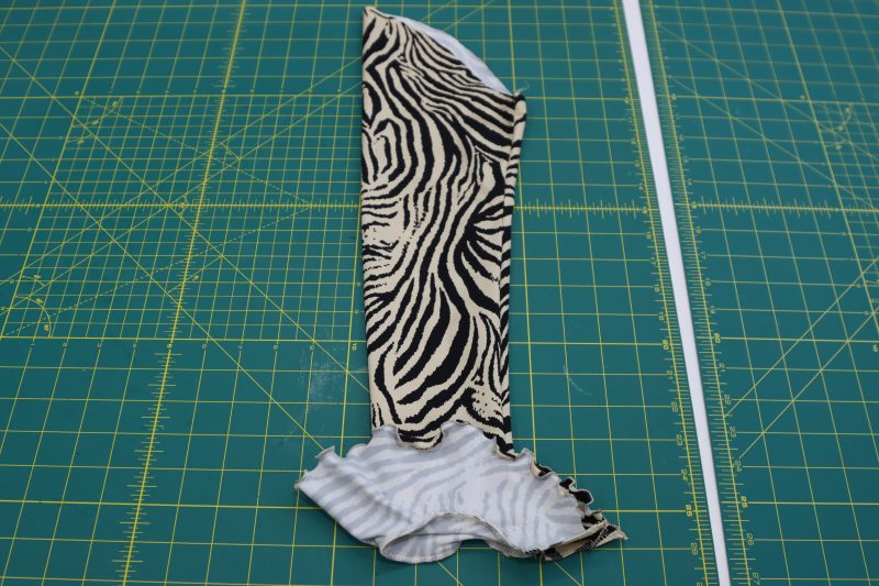 How To Serge Ruffled Cuff To Sleeve - Interlock Knit - Mood Fabrics - Soho Maxi Slip Dress Free Sewing Pattern Tutorial - MDF474 - Mood Fabrics Sewciety Blog - Serge the ruffled cuff to the wrist of the sleeve.