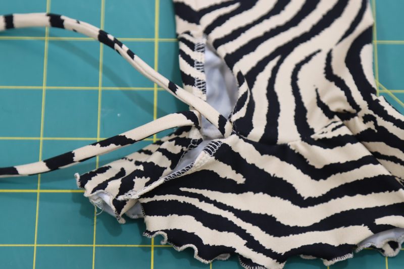 How To Pin Sew Wrist Ties - Interlock Knit - Mood Fabrics - Soho Maxi Slip Dress Free Sewing Pattern Tutorial - MDF474 - Mood Fabrics Sewciety Blog - Pin and sew the wrist ties to the seam between the end of the sleeve and the ruffled cuff.