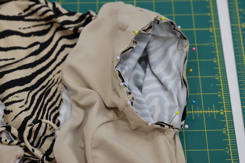 How To Pin Sleeves To Armscyes - Interlock Knit - Mood Fabrics - Soho Maxi Slip Dress Free Sewing Pattern Tutorial - MDF474 - Mood Fabrics Sewciety Blog - Pin the sleeves right sides together with the armscyes of both the lining fabric and the main fabric.
