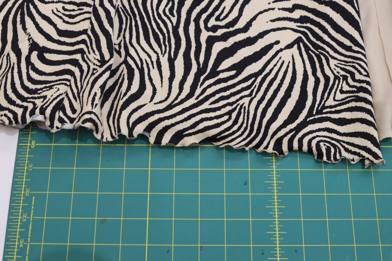 How To Sew Lettuce Leaf Hem Main Fabric - Interlock Knit - Mood Fabrics - Soho Maxi Slip Dress Free Sewing Pattern Tutorial - MDF474 - Mood Fabrics Sewciety Blog - Sew the lettuce leaf hem on the bottom of the main dress.