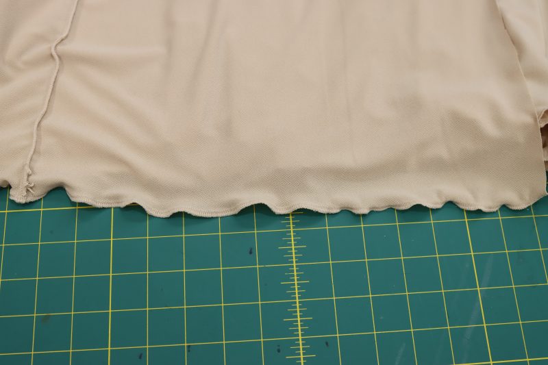How To Sew Lettuce Leaf Hem Lining Fabric - Crepe Knit - Mood Fabrics - Soho Maxi Slip Dress Free Sewing Pattern Tutorial - MDF474 - Mood Fabrics Sewciety Blog - Sew the lettuce leaf hem on the bottom of the lining dress.