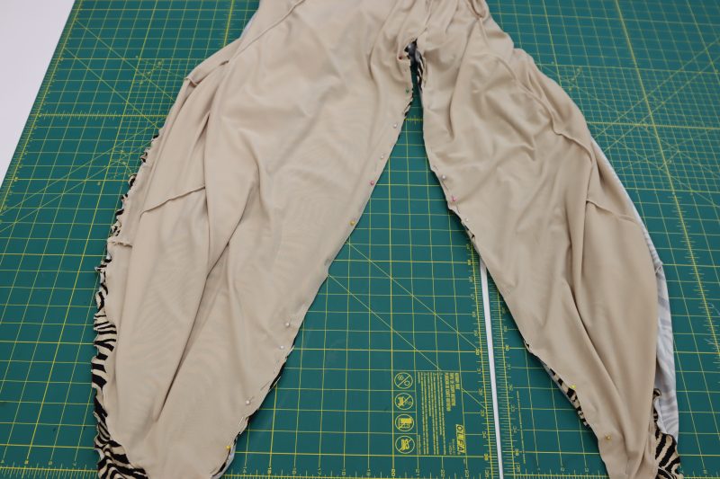 How To Flip Dress Inside Out - Crepe Knit - Mood Fabrics - Soho Maxi Slip Dress Free Sewing Pattern Tutorial - MDF474 - Mood Fabrics Sewciety Blog - Flip the dress inside out and serge both sides of the slit.