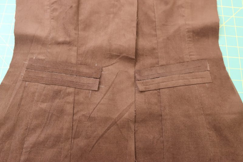 How To Sew Pocket Welts To Chalk Markings - Featherwale Cotton Corduroy - Mood Fabrics - Fawn Mini Dress Free Sewing Pattern Tutorial - MDF476 - Mood Fabrics Sewciety Blog - Sew the pocket welts to the top and bottom chalk lines.