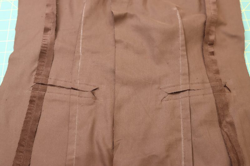 How To Cut Pocket Slit Through Main Fabric - Featherwale Cotton Corduroy - Mood Fabrics - Fawn Mini Dress Free Sewing Pattern Tutorial - MDF476 - Mood Fabrics Sewciety Blog - Cut a slit through the main fabric between the two pocket welts.