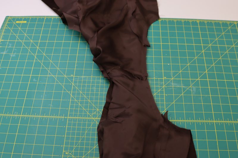 How To Sew Armscyes Right Sides Together - Featherwale Cotton Corduroy - Mood Fabrics - Fawn Mini Dress Free Sewing Pattern Tutorial - MDF476 - Mood Fabrics Sewciety Blog - With the bulk of the dress tucked inside itself, sew the armcyes of the lining and the main fabric right sides together.