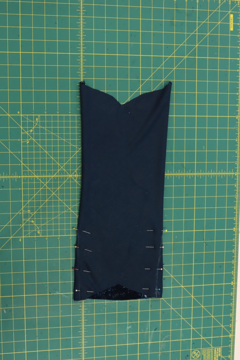 How To Fold Front Top Darts - Metallic Velvet - Mood Fabrics - Jasper Jumpsuit Free Sewing Pattern Tutorial - MDF486 - Mood Fabrics Sewciety Blog - Fold and pin the front top over the two darts, right sides together.