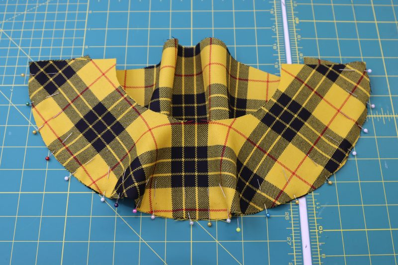 How To Pin Sleeve Outer Edges - Virgin Wool Twill - Mood Fabrics - Silverstone Mini Dress Free Sewing Pattern Tutorial - MDF489 - Mood Fabrics Sewciety Blog - Pin the outer edge of the lower sleeve to the bottom edge of the upper sleeve.