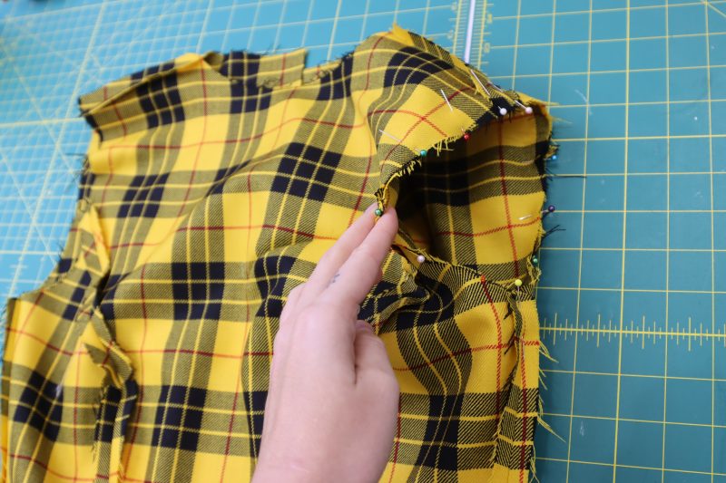 How To Pin Sew Sleeve Cap To Armscye - Virgin Wool Twill - Mood Fabrics - Silverstone Mini Dress Free Sewing Pattern Tutorial - MDF489 - Mood Fabrics Sewciety Blog - Pin the sleeve cap to the armscye, right sides together.