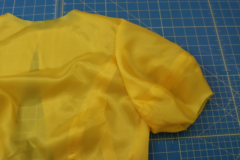 How To Sew Lining Sleeve - Bemberg Lining - Mood Fabrics - Silverstone Mini Dress Free Sewing Pattern Tutorial - MDF489 - Mood Fabrics Sewciety Blog - Sew the sleeve to the armscye for both the main fabric and the lining.