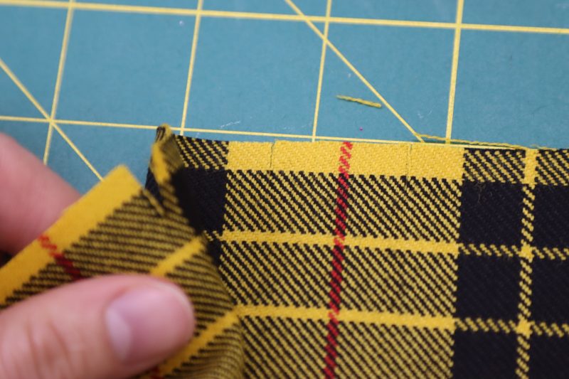 How To Line Up Innermost Notches - Virgin Wool Twill - Mood Fabrics - Silverstone Mini Dress Free Sewing Pattern Tutorial - MDF489 - Mood Fabrics Sewciety Blog - Line up the innermost notch with the one closest to it.