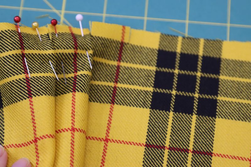 How To Pin Second Pleat - Virgin Wool Twill - Mood Fabrics - Silverstone Mini Dress Free Sewing Pattern Tutorial - MDF489 - Mood Fabrics Sewciety Blog - Pin the second pleat in place.