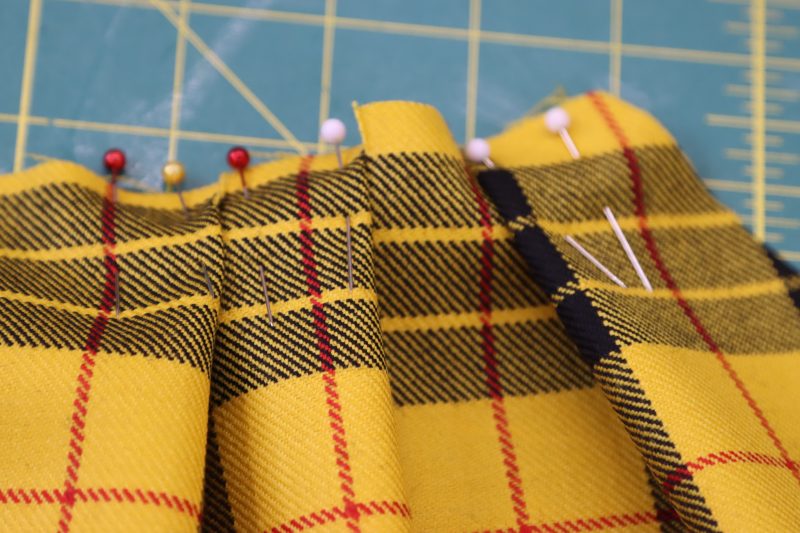 How To Pin Third Pleat - Virgin Wool Twill - Mood Fabrics - Silverstone Mini Dress Free Sewing Pattern Tutorial - MDF489 - Mood Fabrics Sewciety Blog - Pin the third pleat in place.