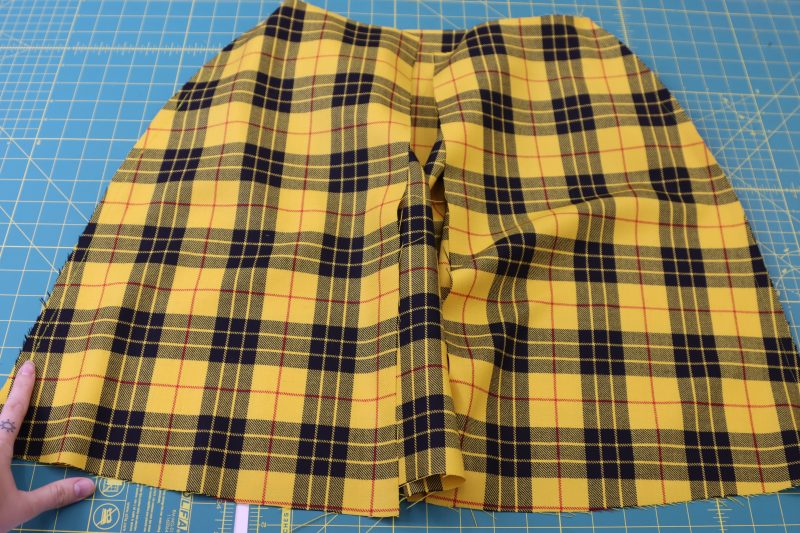 How To Pin Sew Main Fabric Skirt Side Seams - Virgin Wool Twill - Mood Fabrics - Silverstone Mini Dress Free Sewing Pattern Tutorial - MDF489 - Mood Fabrics Sewciety Blog - Pin and sew the side seams of the main fabric skirt.