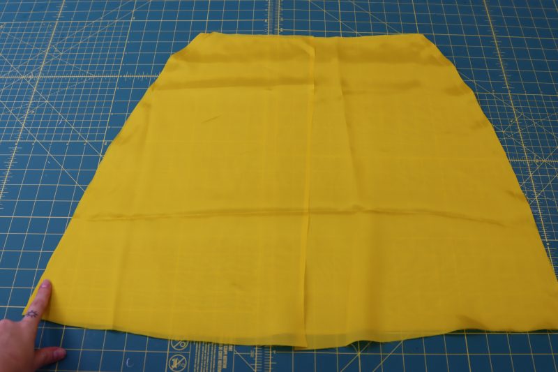 How To Pin Sew Lining Skirt Side Seams - Bemberg Lining - Mood Fabrics - Silverstone Mini Dress Free Sewing Pattern Tutorial - MDF489 - Mood Fabrics Sewciety Blog - Pin and sew the lining skirt side seams.