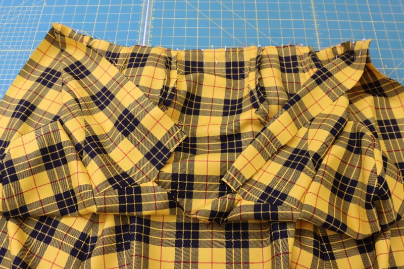 How To Pin Sew Top Skirt Waistlines - Virgin Wool Twill - Mood Fabrics - Silverstone Mini Dress Free Sewing Pattern Tutorial - MDF489 - Mood Fabrics Sewciety Blog - Pin and sew the skirt waistline to the top waistline.
